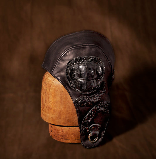 Stan Gaz Handmade, made in USA. Steam punk fighter pilot hat with hand sewn crocodile leather and silver d rings for straps. Hat is available in Medium. It can be custom made in whatever size needed.