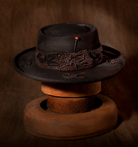 Stan Gaz Handmade 100% beaver fur felt, made in USA. Hand made with branded leather hat band. Laser cut leather scorpion shapes cut and hand sewn to hat. Hand made silver and rare bead hat pin. Leather sweat and silk lining. Hat is available in Large. It can be custom made in whatever size needed.