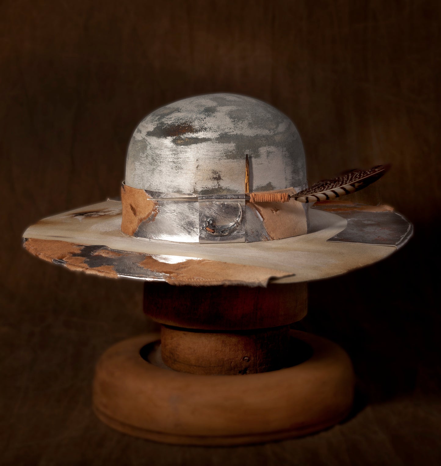 Stan Gaz Handmade 100% beaver fur felt, made in USA. Hand dyed, painted, metallic paint on leather, selected burns on hat body, carved silver dart, silver raptor claw, custom leather sweat ban, distressed, hand sewn. Unique wearable art. Hat is available in Large. It can be custom made in whatever size needed.