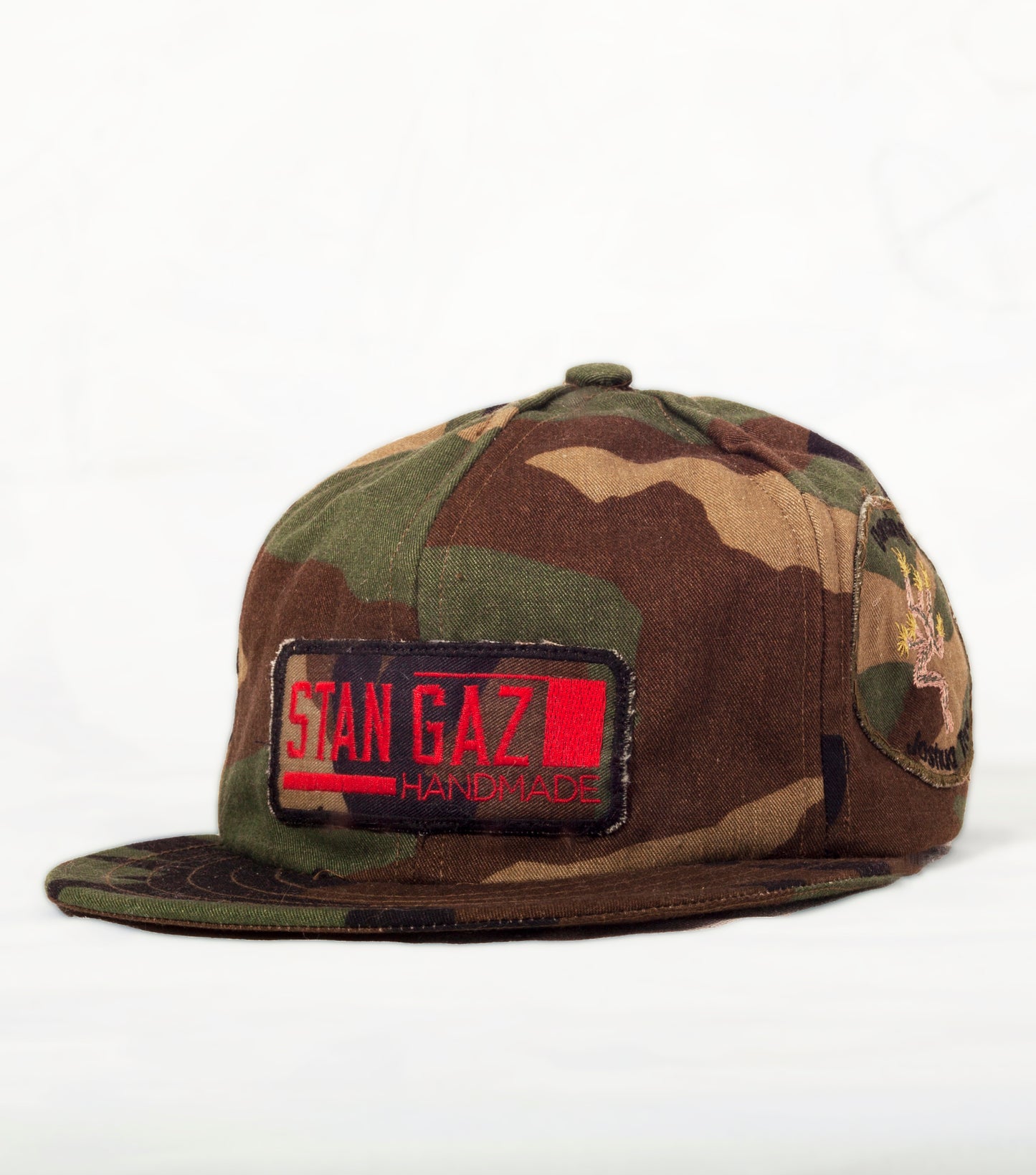 Vintage 1960's camouflage fabric used to hand make this baseball hat with hammered silver D rings to adjust size options and olive green leather strap.