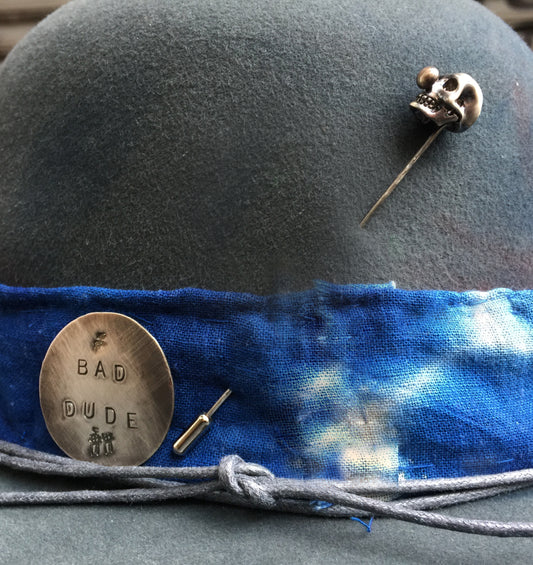 Handmade clown skull hat pin, silver with antique patina.