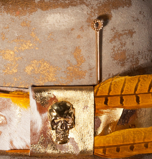 Handmade gold plaited bubble blower hat pin.