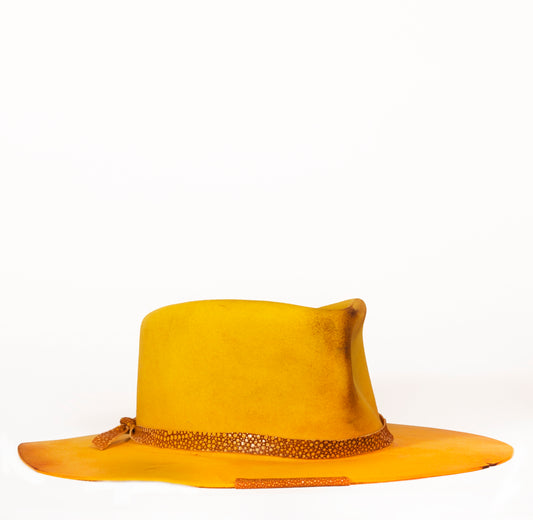 Yellow Wing is a custom beaver fur felt inspired by the great American landscape. Distressed with leather and silk.