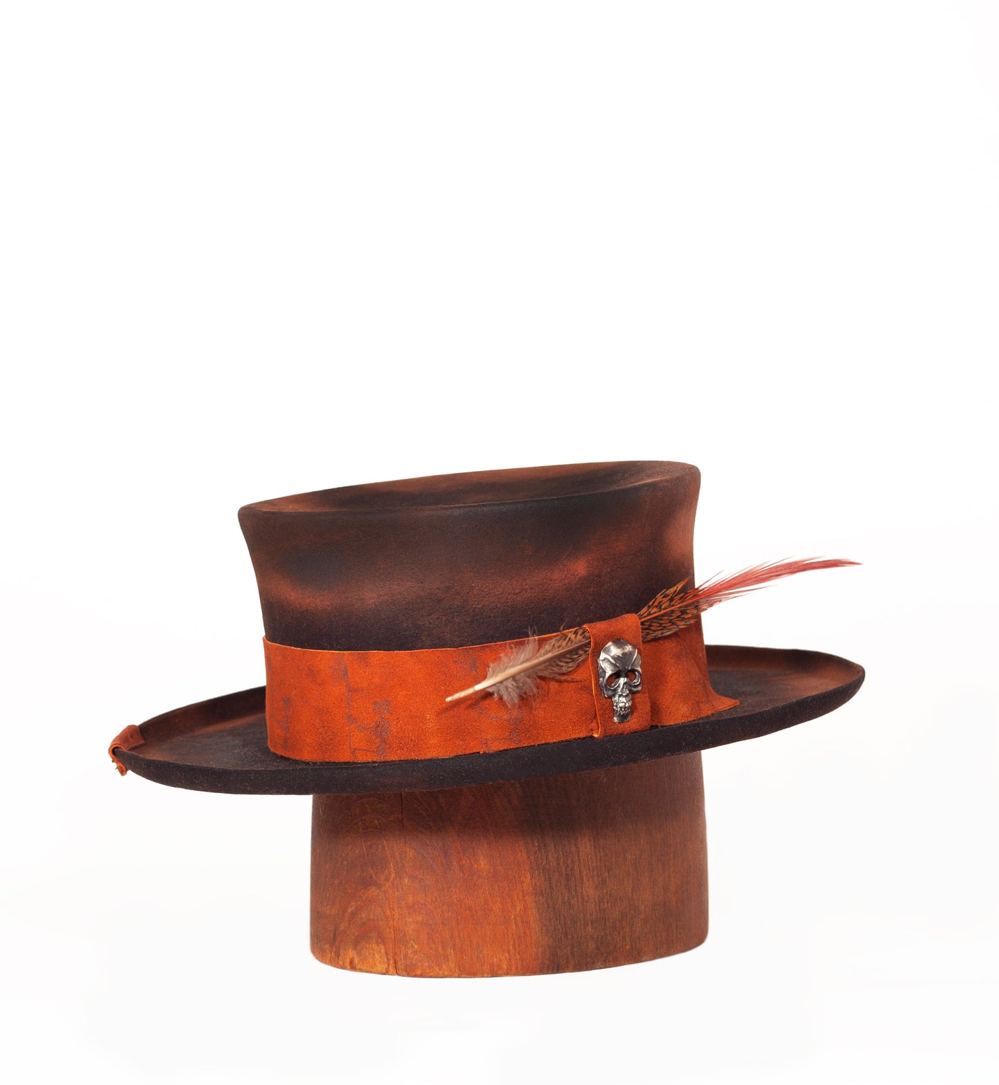 Death Valley is a short Topper 100% Beaver Fur Felt. Custom made with a solid silver skull pin. Also, a branded suede leather hat band, leather sweat band and silk lining.