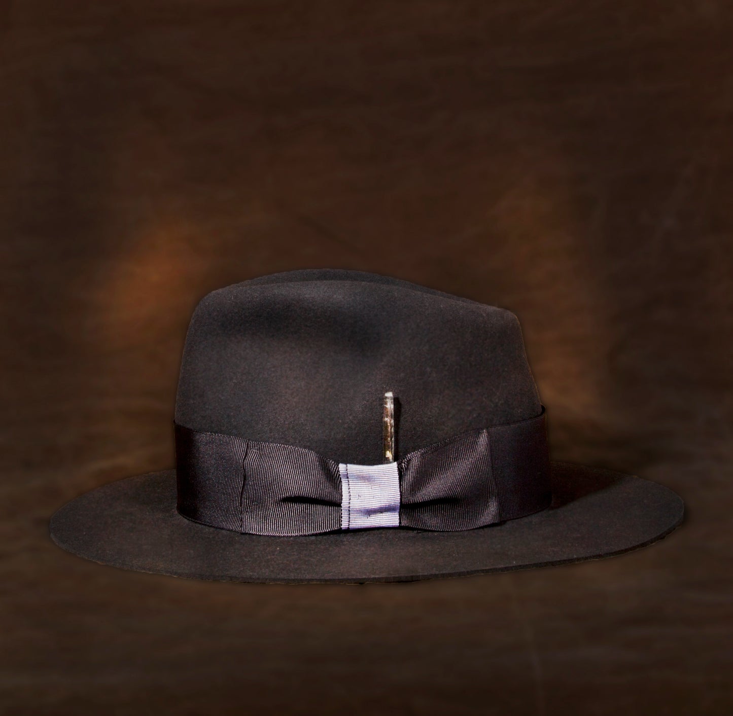This fedora Stan Gaz Handmade 100% beaver fur felt, made in USA.  Hand shaped, leather sweat band. Feather, silk lining, and custom patina.  Hat is available in Medium. It can be custom made in whatever size needed.  