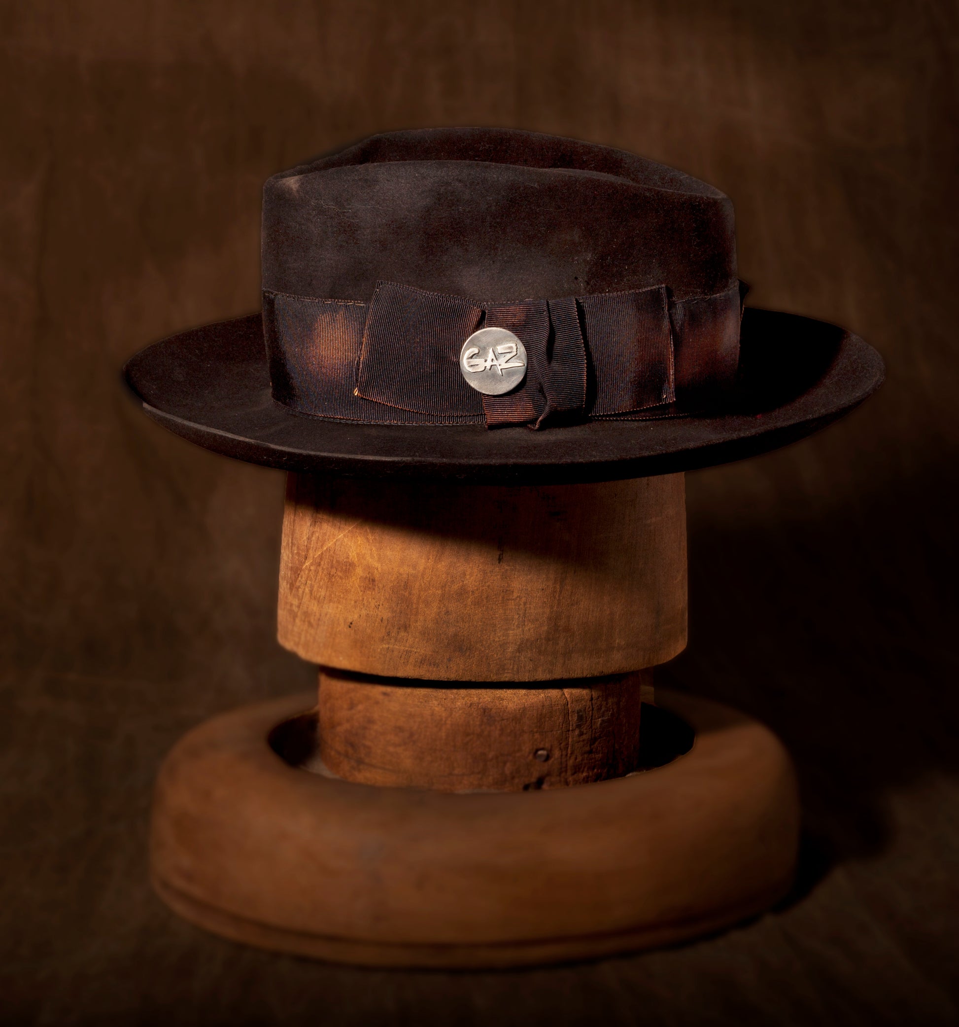 Stan Gaz Handmade 100% beaver fur felt, made in USA.  Silver GAZ hat pin. Custom patina and distressed, hand sewn and shaped. Leather sweat band with silk lining.  Hat is available in Medium. It can be custom made in whatever size needed. 