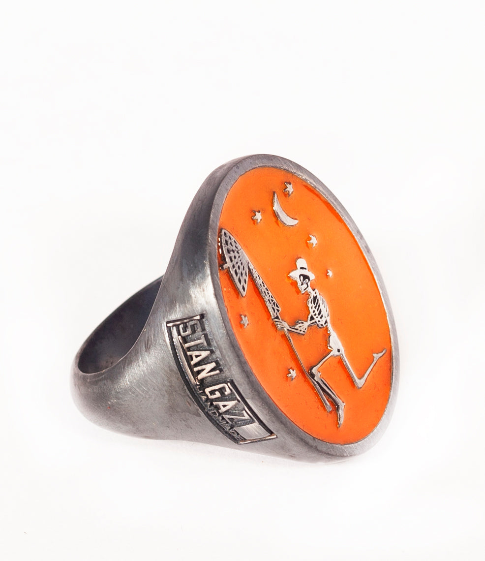 Silver skeleton signet ring with orange enamel enamel. Custom logo on sides. Hand patina.