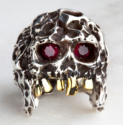 Handmade custom skull ring made from silver, gold and red pigeon blood rubies. The ring can have a dark patina or left natural silver.      This ring can be custom made in any ring size requested. 